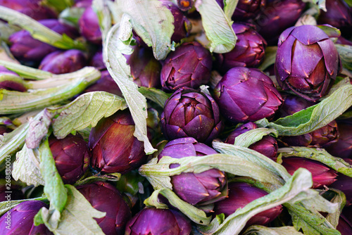 Purple artichokes (carciofi) at an Italian farmers market photo