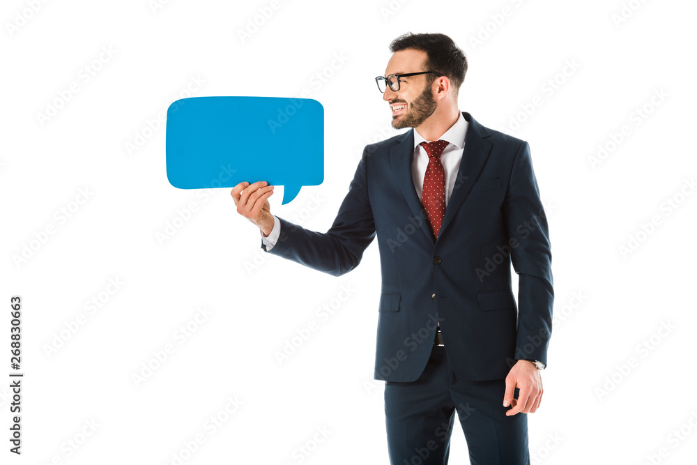 cheerful handsome businessman in black suit holding speech bubble isolated on white cheerful handsome businessman in black suit holding speech bubble isolated on white