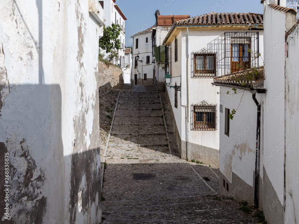 Fototapeta premium Old buildings of the streets around the cathedral of Granada, in the old town in Granada, Spain