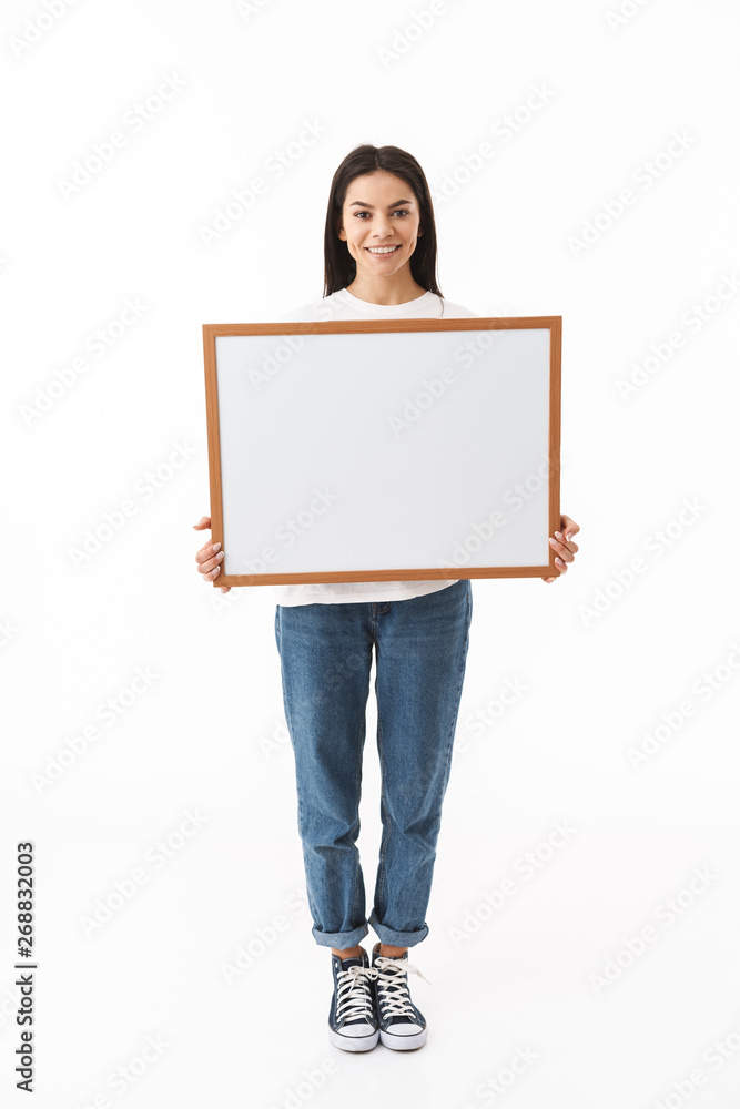 Happy young woman standing isolated over white Happy young woman standing isolated over white