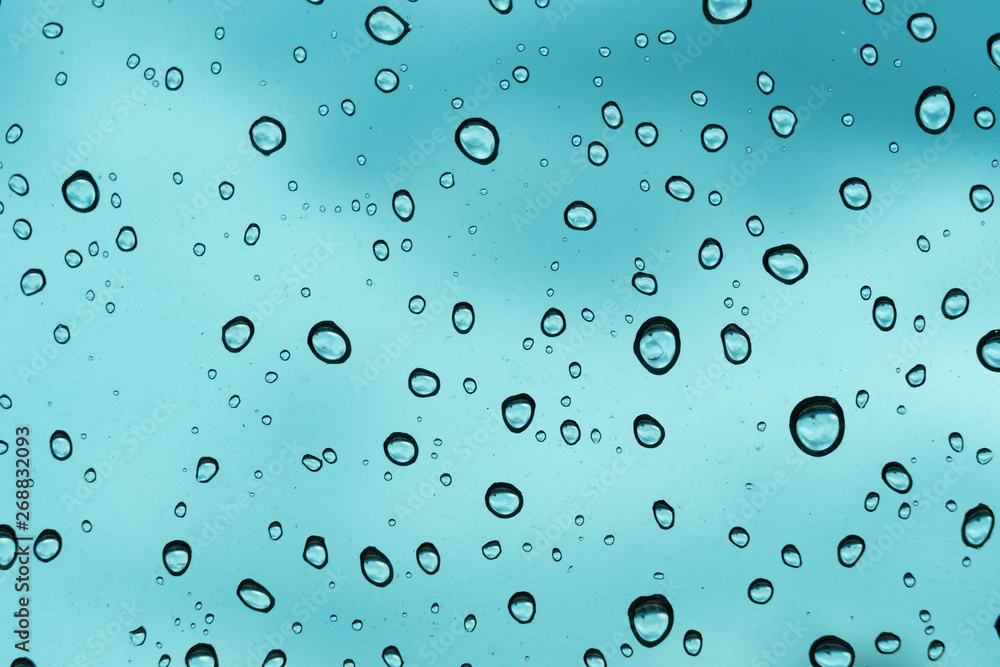 Blue background, Natural water drop on glass. Blue background, Natural water drop on glass.