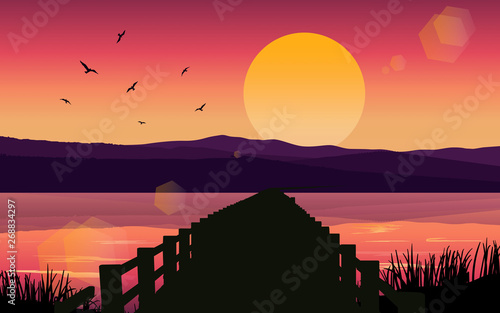 landscape of wooden walkway on the river in sunset
