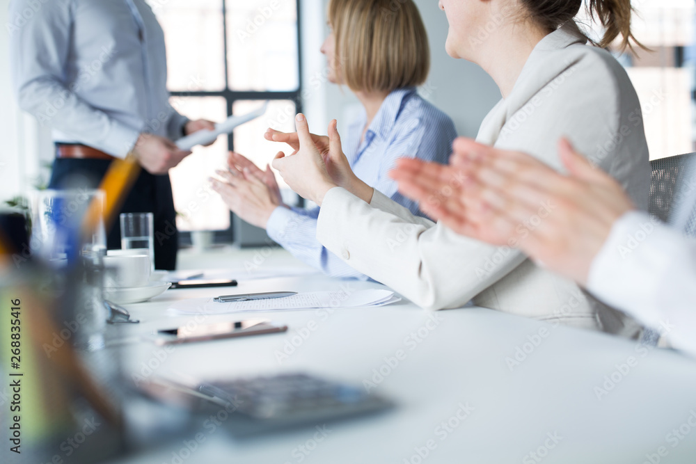 Fototapeta premium business, corporate and success concept - colleagues applauding to businessman at office meeting or presentation