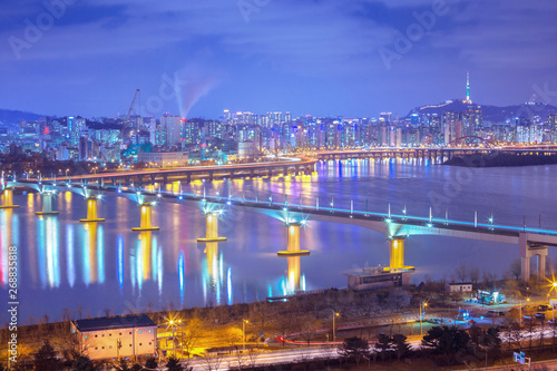 Seoul city and Cars passing on The bridge and Traffic, Han River at Night in Downtown Seoul, South Korea.