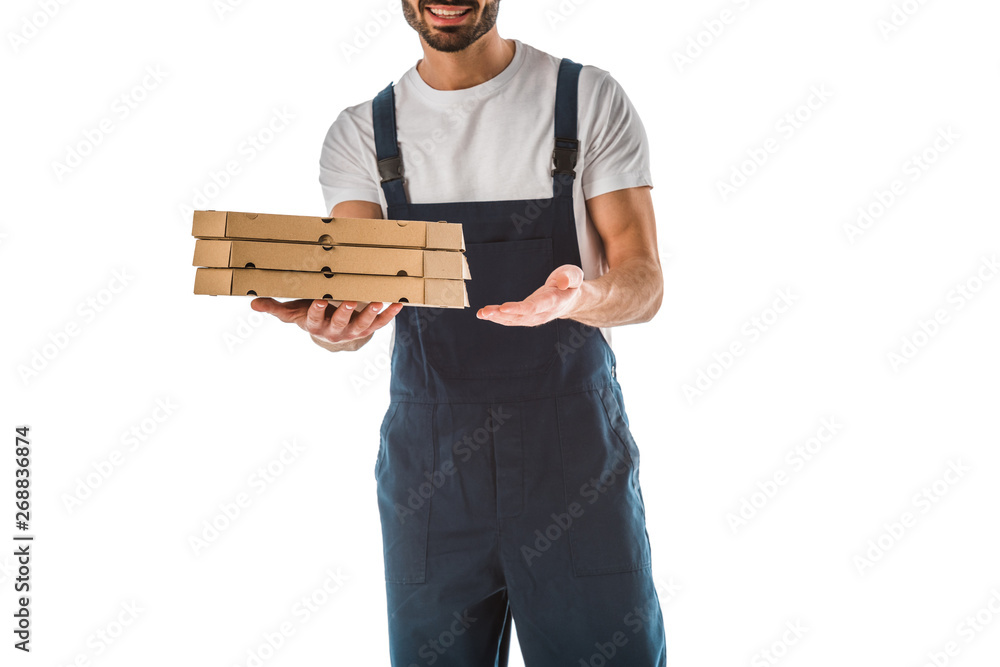 partial view of smiling delivery man holding pizza boxes isolated on white partial view of smiling delivery man holding pizza boxes isolated on white