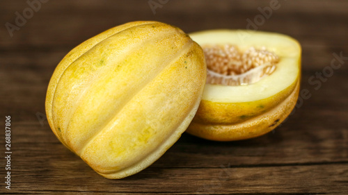 Cantaloupe or blewah on wood background.  photo