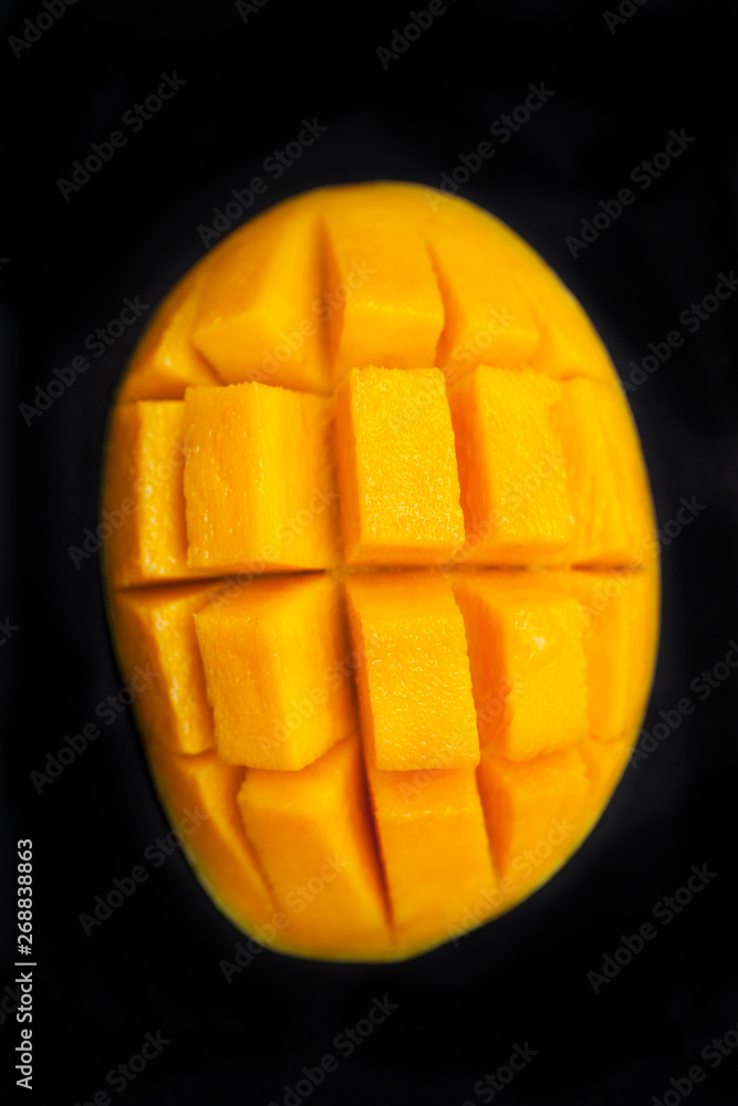 Fresh mango organic product. Dark background. Close up. Top view. Fresh mango organic product. Dark background. Close up. Top view.