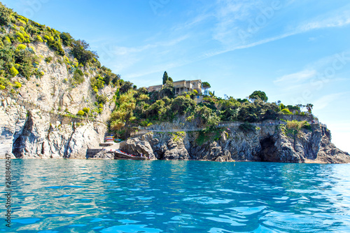 Liguria  Italy coastline of Riviera with colorful houses on sunny warm day. Monterosso al Mare  Vernazza  Corniglia  Manarola and Riomaggiore  Cinque Terre National Park UNESCO World Heritage