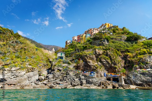 Corniglia, Liguria, Italy fisherman village, colorful houses on sunny warm day. Monterosso al Mare, Vernazza, Corniglia, Manarola and Riomaggiore, Cinque Terre National Park UNESCO World Heritage photo