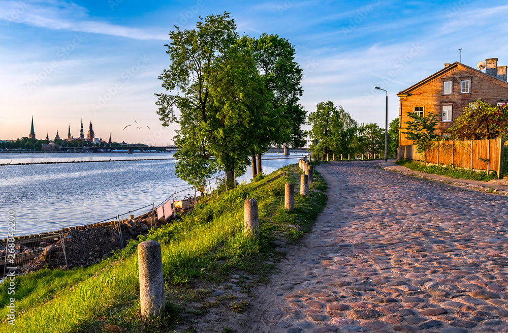 View on medieval church and historical part of Riga from old street of Kipsala island, Latvia, EC