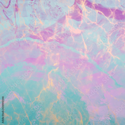 Marble with natural mother of pearl in turquoise and pink colors. Multicolored marble.