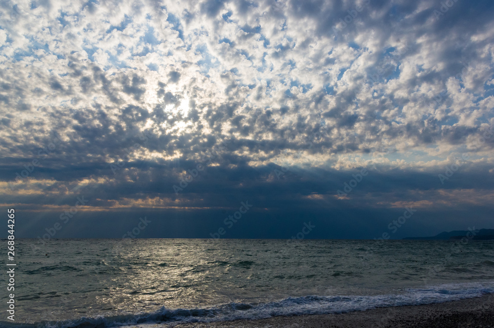 sea landscape is a pebbly beach with waves in white foam sea landscape is a pebbly beach with waves in white foam