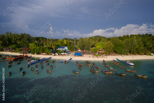 Aerial drone view of the boats in the sea near beautiful tropical Koh Lipe island in Thailand