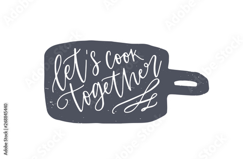 Let's Cook Together phrase handwritten on cutting board