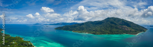 Fototapeta Naklejka Na Ścianę i Meble -  Aerial drone view of beautiful green Koh Usen island with amazing lagoon sea over summer sky background, Thailand