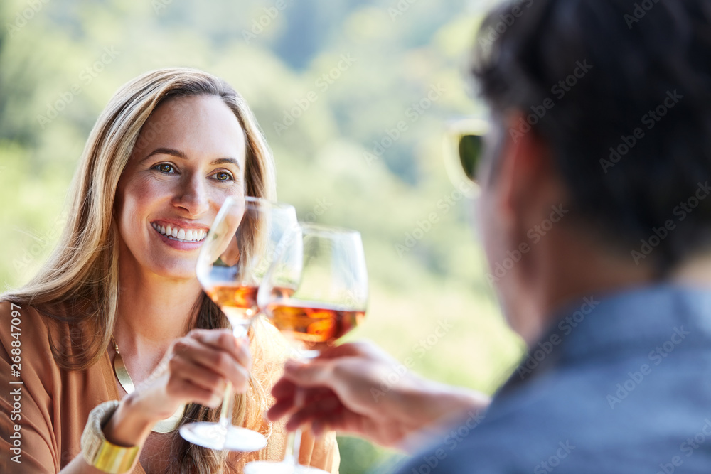Couple toasting wine in Napa Valley, CA Couple toasting wine in Napa Valley, CA