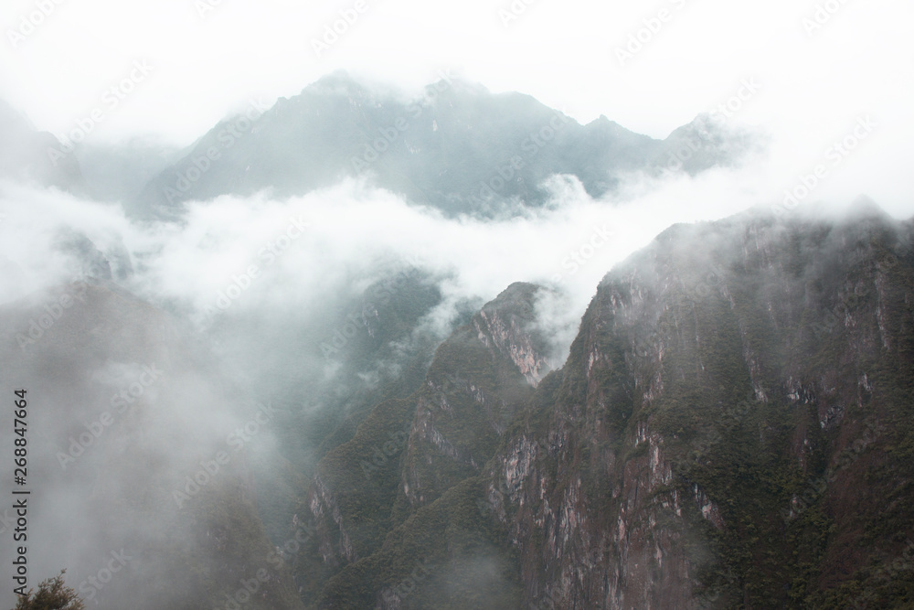 clouds over mountains Machu Picchu