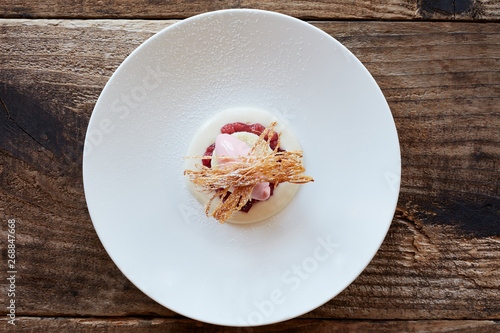 Gourmet dessert with rhubarb and cake