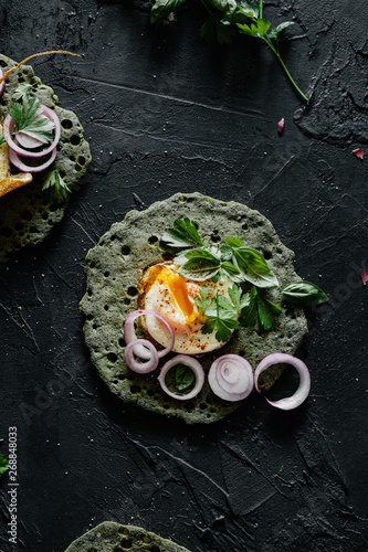 Green Lachuch with Fried Eggs and Shallot Rings photo