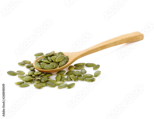  Pumpkin seeds in wooden spoon isolated on white background