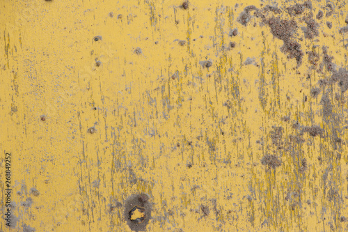 Painted yellow wall cracked paint