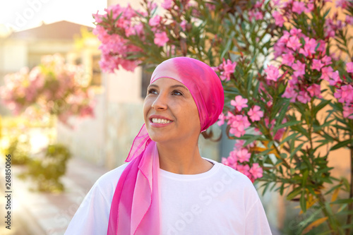 Obraz na płótnie Woman with pink scarf on the head