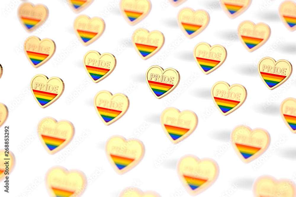 Blurry closeup shot on golden heart with rainbow and word PRIDE inside pattern. June as month of pride concept. Isolated on white background. 3D rendering