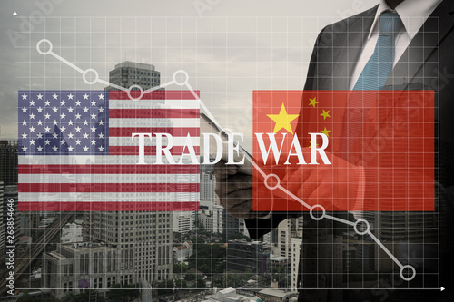 Double exposure of Businessman , trade war between the biggest economies, us and china make the world be economic crisis concept
