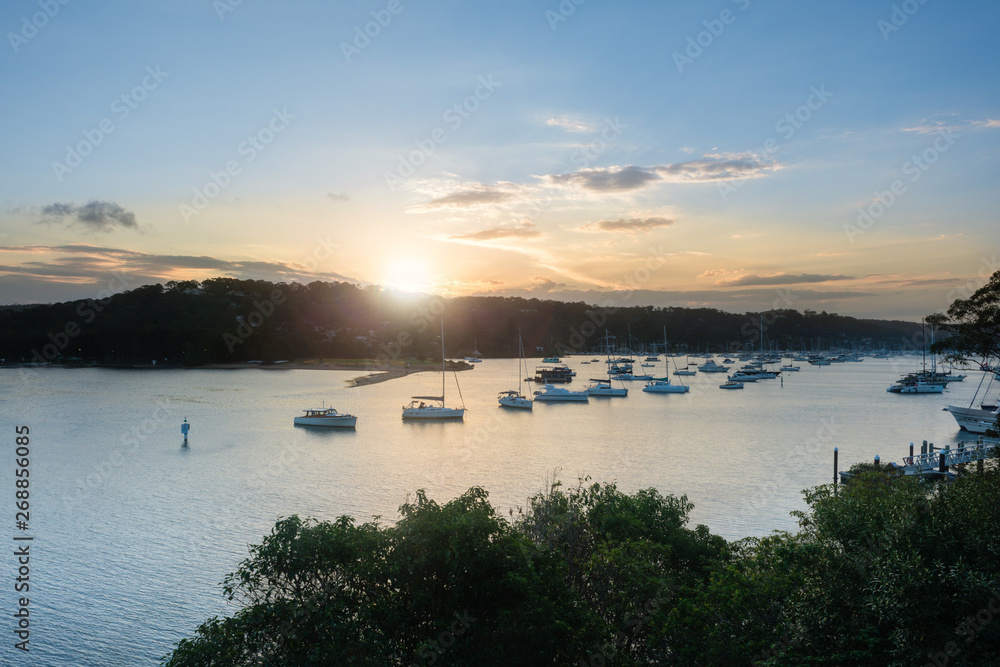 sun setting on harbour in Sydney sun setting on harbour in Sydney