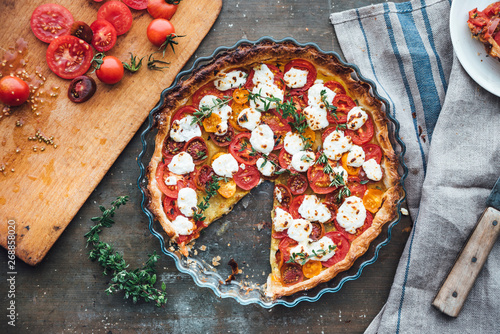 Food: Tomato tart with goat cheese and thyme on mustard photo