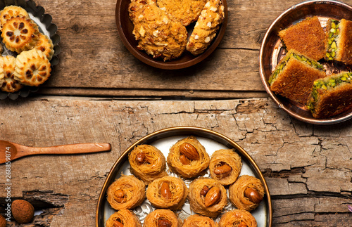 Arabic desserts in rustic bowls top view