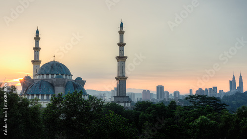 A view of a blue mosque in Kuala Lumpur, Malaysia during sunrise