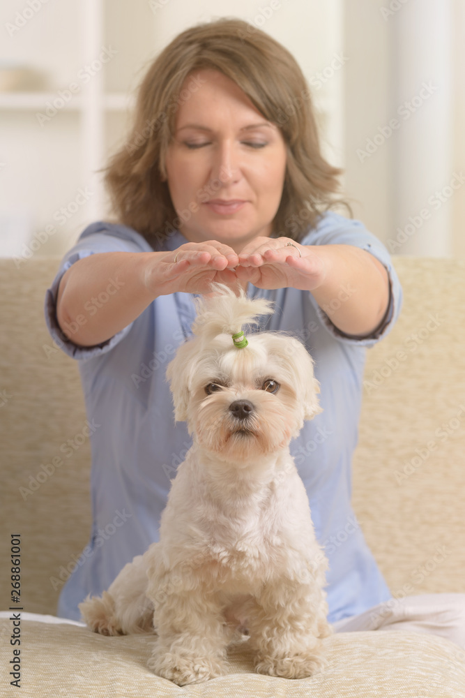 Woman practicing reiki therapy Woman practicing reiki therapy