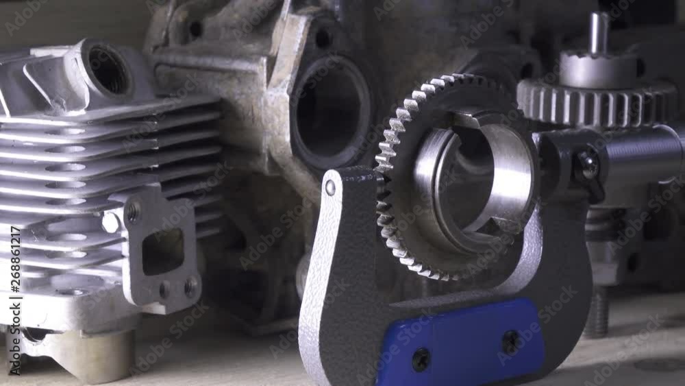 Industrial still life a micrometer against the background of details of cars and mechanisms.Dolly shot Industrial still life a micrometer against the background of details of cars and mechanisms.Dolly shot