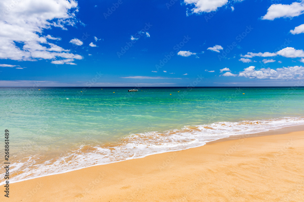 Blue ocean wave on sandy beach. Soft wave of blue ocean on sandy beach. Background. Top view of Beautiful beach with tranquil wave, sea and ocean background, summer vacation concept. Blue ocean wave on sandy beach. Soft wave of blue ocean on sandy beach. Background. Top view of Beautiful beach with tranquil wave, sea and ocean background, summer vacation concept.