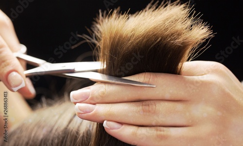 Man having a haircut with s...