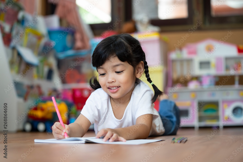 Kid Asian student doing homework .Kid enjoy learning with happiness at home. Education concept. Kid Asian student doing homework .Kid enjoy learning with happiness at home. Education concept.