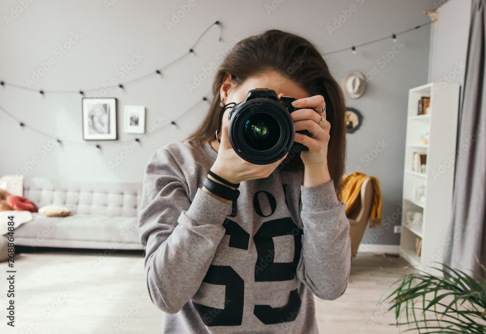 Women photographer hold camera and taking a photo Women photographer hold camera and taking a photo