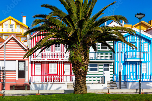 Street with colorful houses in Costa Nova, Aveiro, Portugal. Street with striped houses, Costa Nova, Aveiro, Portugal. Facades of colorful houses in Costa Nova, Aveiro, Portugal.