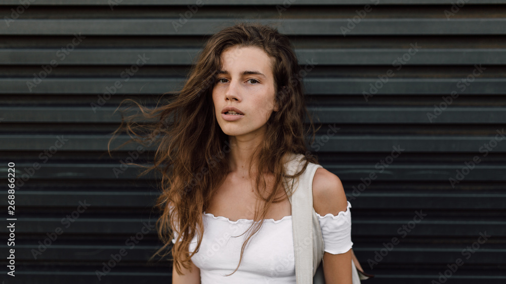 Portrait of beautiful brunette woman against the black background Portrait of beautiful brunette woman against the black background