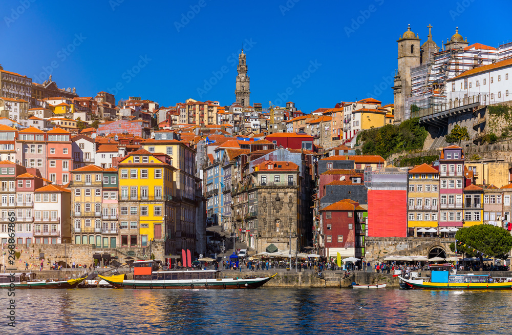 Ancient city of Porto with old multi-colored houses with red roof tiles. Portugal, Porto