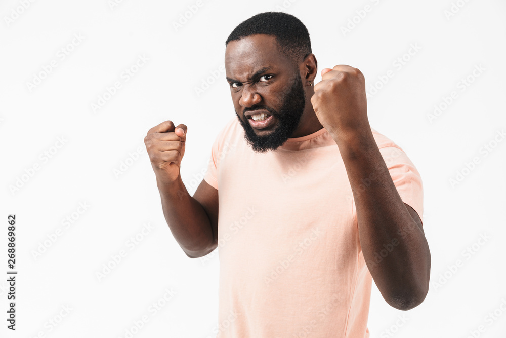 Portrait of an angry african man wearing t-shirt Portrait of an angry african man wearing t-shirt