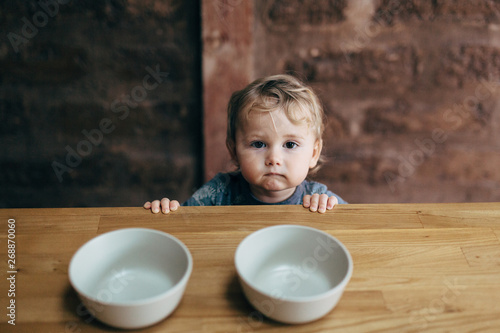 Toddler with bowls photo