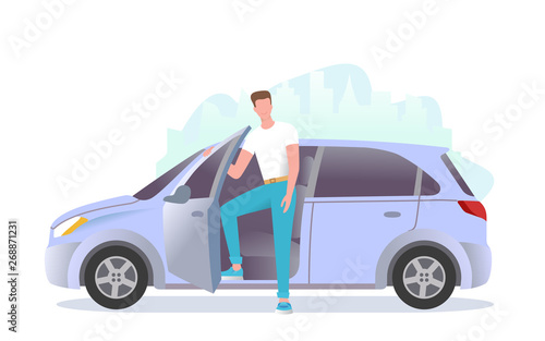 A young man is standing next to the car. A guy is getting into the car.