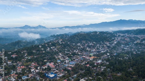 Beautiful Kandy city surrounded by mountains and mist skyline