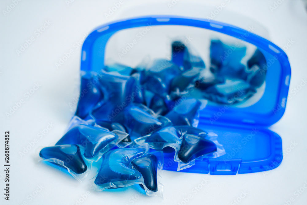 Liquid wash detergent in capsules. Plastic box. Washing soap. Liquid wash detergent in capsules. Plastic box. Washing soap.