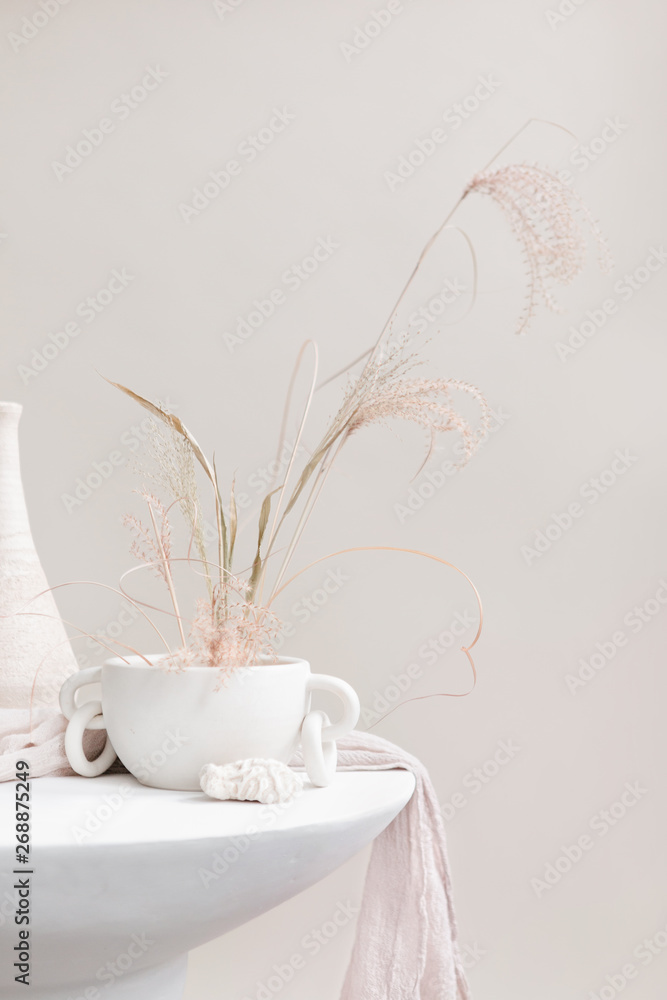 Dried flower arrangement in handmade vase Dried flower arrangement in handmade vase