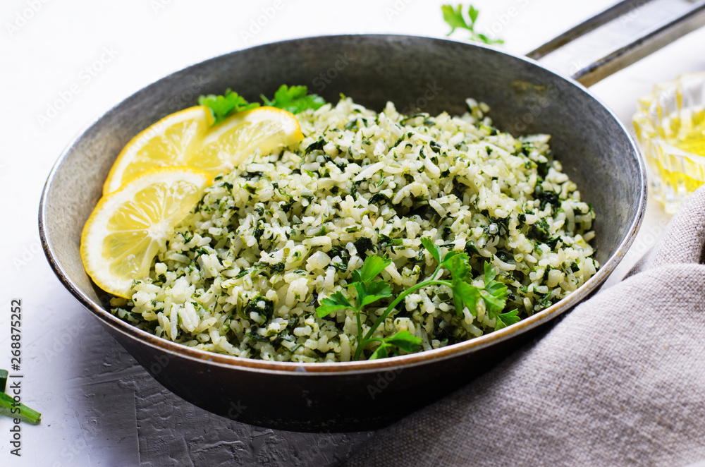 Spinach Rice in a Skillet over White Background Spinach Rice in a Skillet over White Background