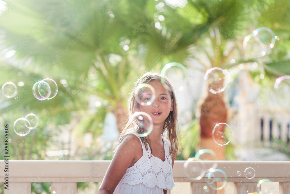 Girl playing with soap bubbles Girl playing with soap bubbles