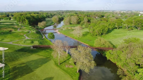 Aerial flying down over Conestoga river, running through Lancaster golf course 4k photo